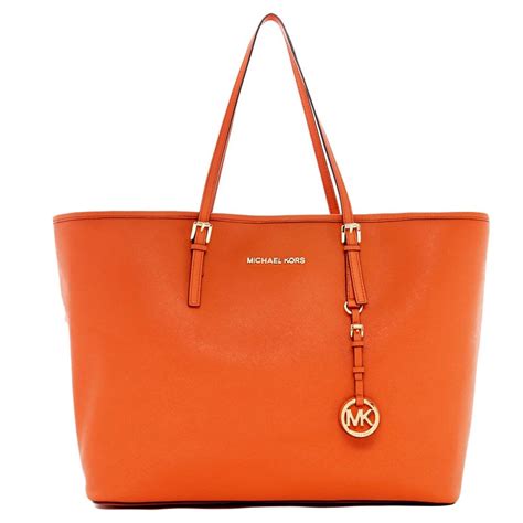 michael kors burnt orange handbag.